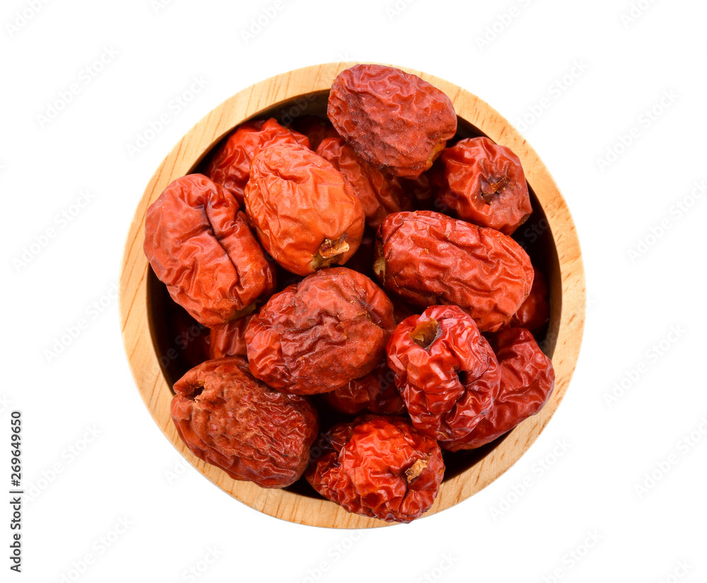 Chinese jujube isolated In wooden spoon on white background Chinese jujube isolated In wooden spoon on white background
