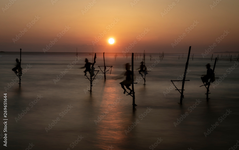 Stilt Fishermen in Sri Lanka Working For Dinner at Sunset