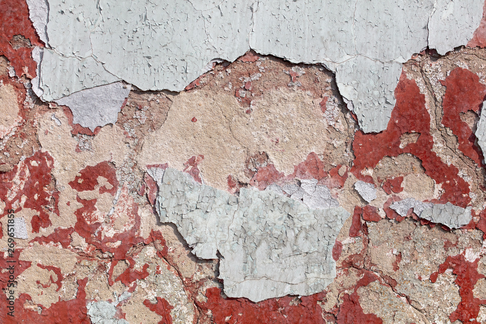 Fototapeta premium Concrete wall with cracked paint as abstract background