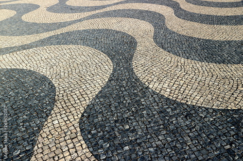 Portuguese pavement of black basalt and white limestone in Lisbon.