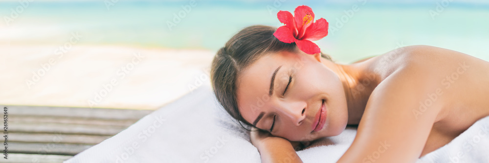 Spa massage therapy woman lying on massage table for full body scrub or deep tissue swedish luxury treatment. Banner panoramic background. - obrazy, fototapety, plakaty 