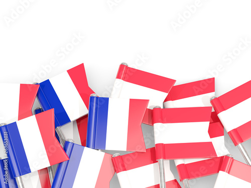 Pins with flags of France and austria isolated on white.