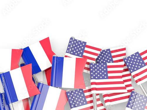 Fototapeta Naklejka Na Ścianę i Meble -  Pins with flags of France and United States isolated on white.