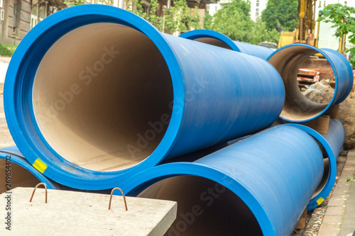 Corrugated water pipes of blue color, large diameter, prepared for laying.