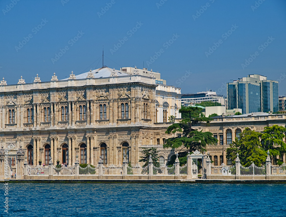 Dolmabahce palace exterior and modern builings view from sea. Istanbul, Turkey.