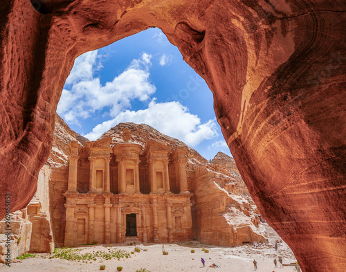 The Treasury  through a cave opening at Petra Ruins in Jordan photo