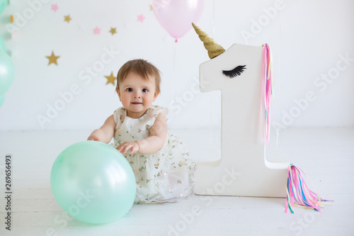 Cute baby girl portrait at birthday party photo