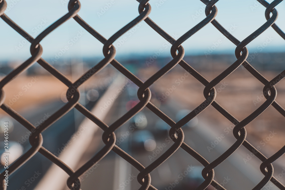 Highway view through fence Highway view through fence