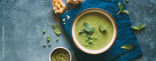 Photography Green pea cream soup with mint. Vegetarian healthy soup