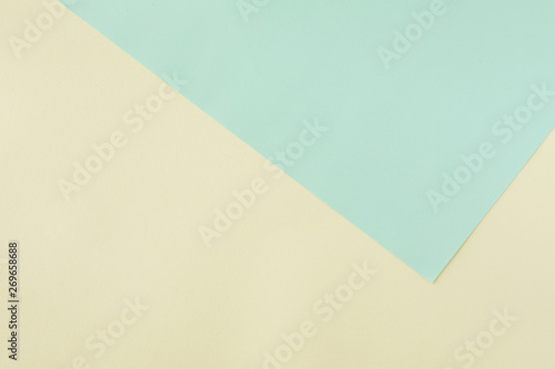 Green and yellow pastel paper color for background, top view