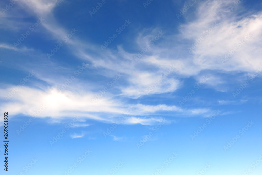the bright blue sky background with some white cloud the bright blue sky background with some white cloud