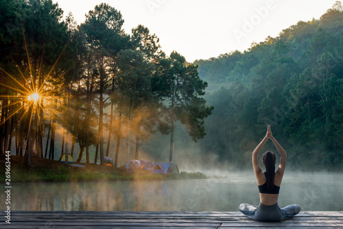 Young woman practicing yoga in the nature