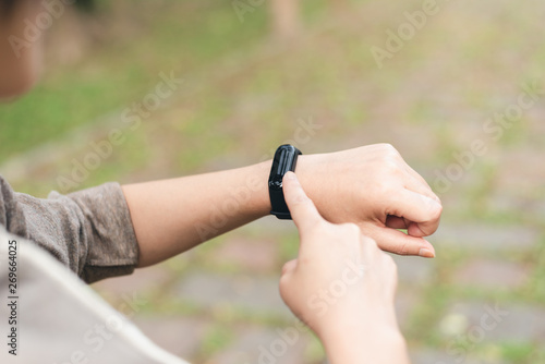 woman using smart watch