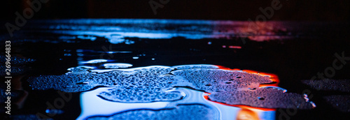 Wet asphalt, night scene of...