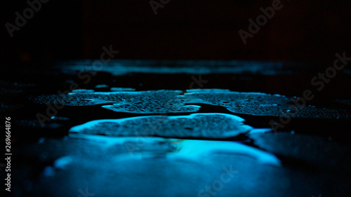 Wet asphalt, night scene of...