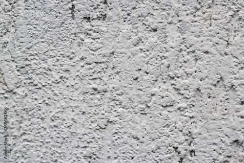 White bits texture on a concrete wall