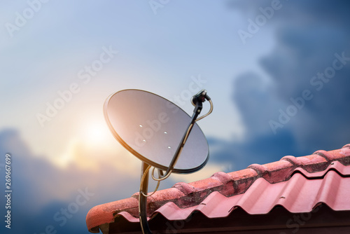 Communication concept with Satellite dish on sunshine background