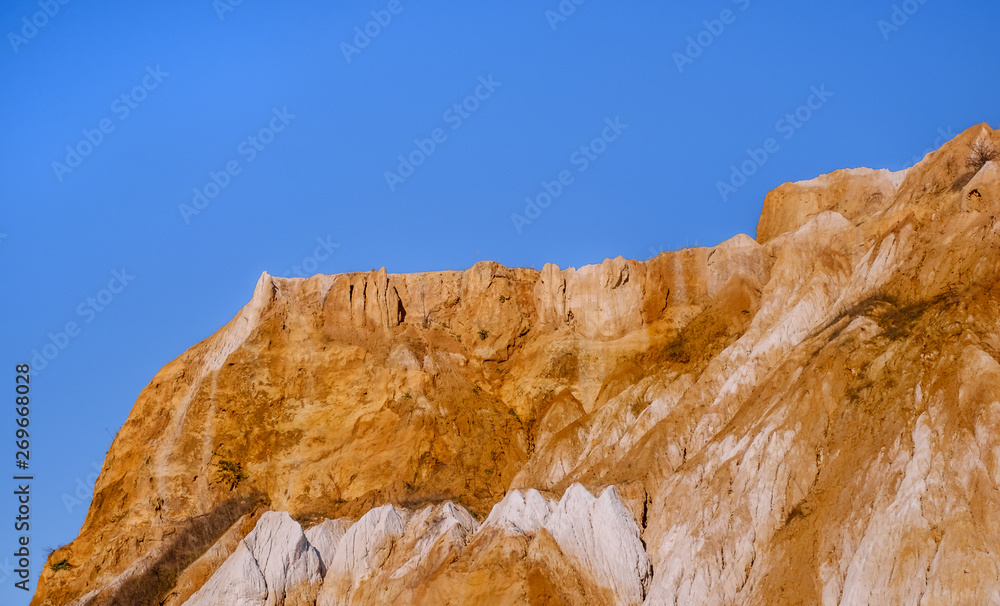 a fragment of a quarry of kaolin mining with beautiful blue sky