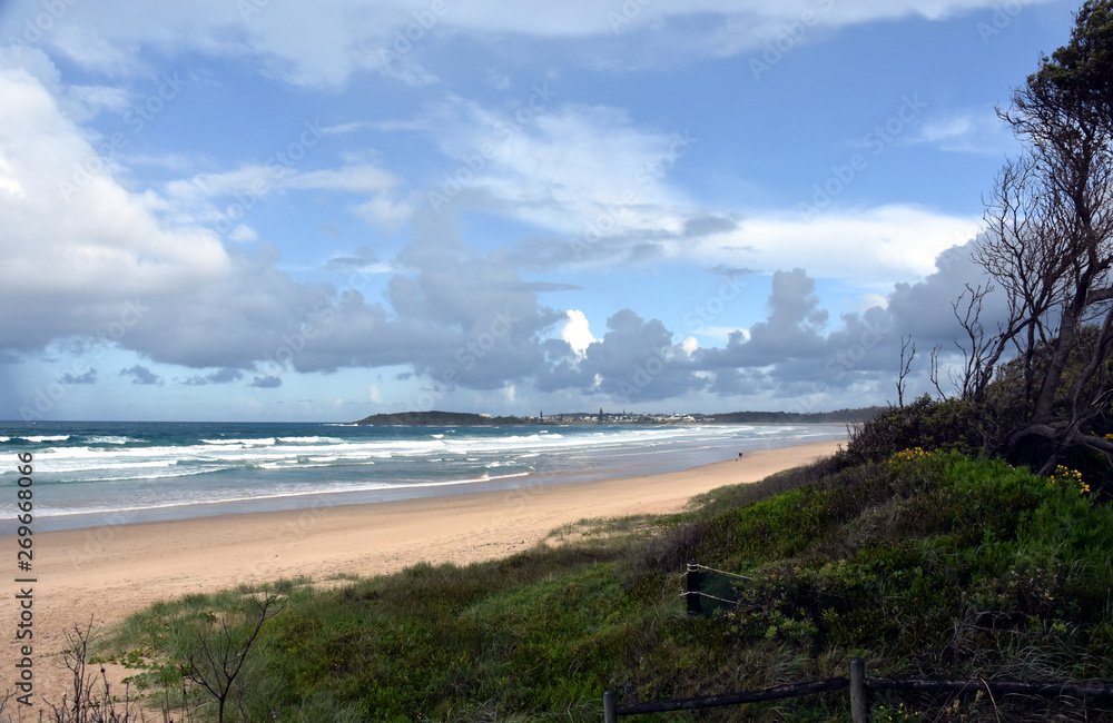 Panoramic landscape of Arrawarra, Arrawarra Headland and beach in New South Wales, Australia on a cloudy and rainy day before storm.