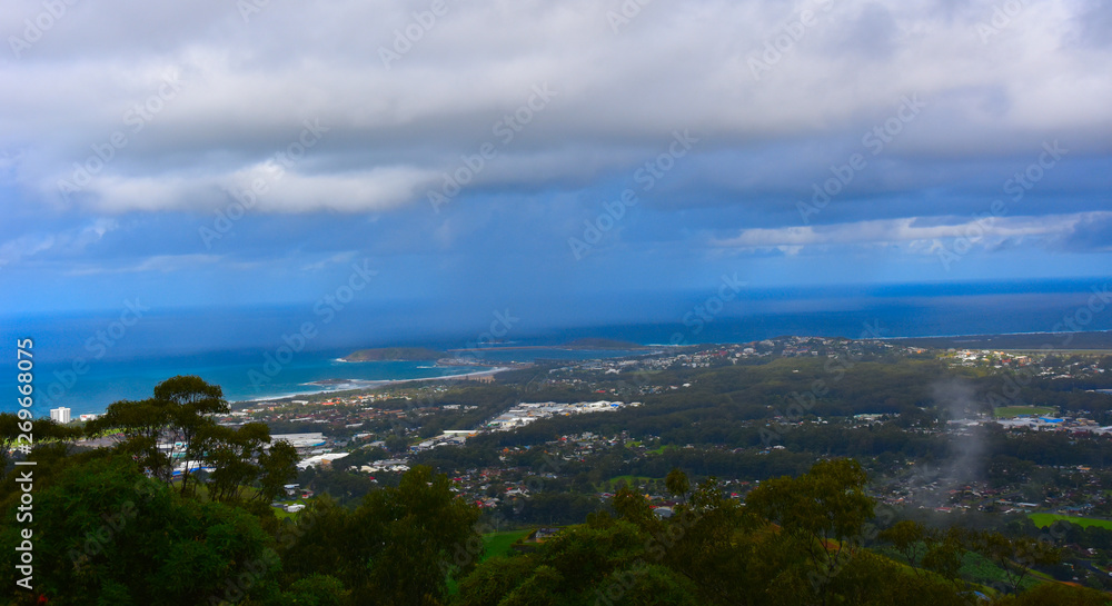 View of Coffs Harbour from Forest Sky Pier, which is a lookout pier with sweeping views on a cloudy day.