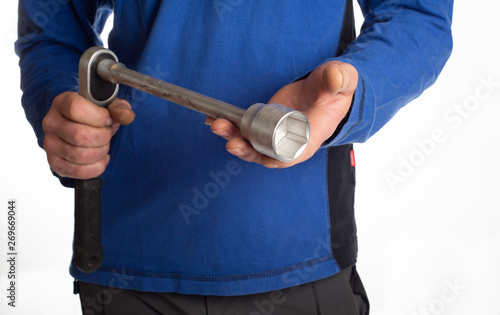 Handwerker mit Inbusschlüssel in der Hand, craftsman with screw driver photo