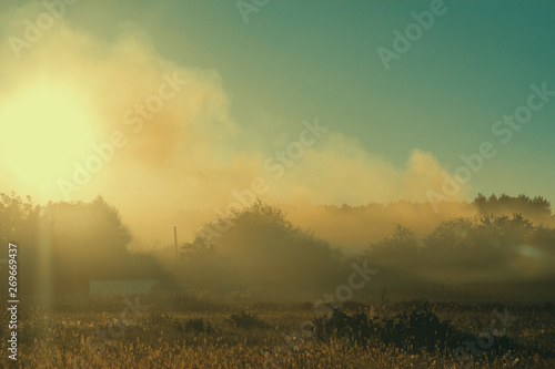 Sunset in the village / mist