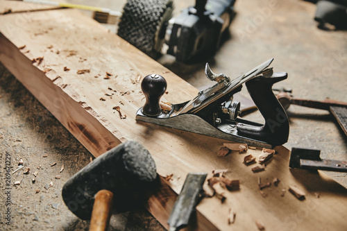Carpentry equipment tools on work table and wood