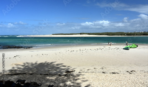 Caloundra, Australia - Apr 21, 2019. People having fun at Bulcock beach.  Bribie sandy Island in the background (Sunshine Coast, Queensland, Australia). photo