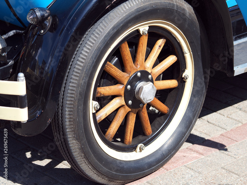 The wheel of an old car with wooden spoke of the early twentieth century © Sergey