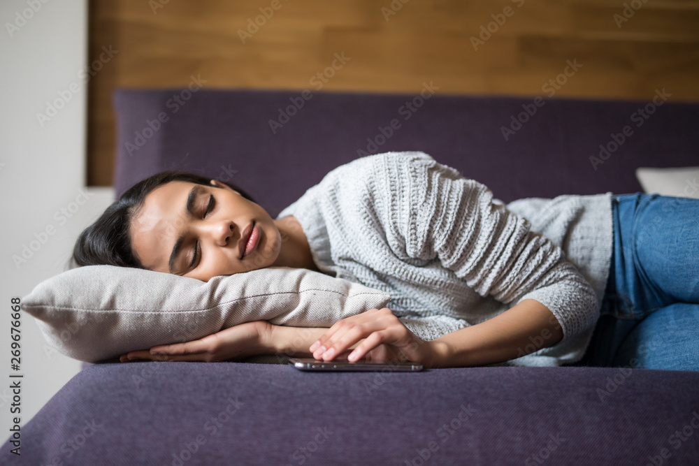 Young beautiful woman sleeping on the sofa at home Young beautiful woman sleeping on the sofa at home
