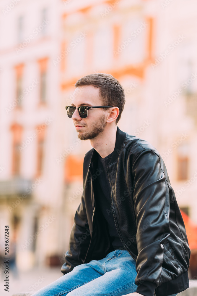 young guy with beard dressing in black leather jacket, wearing s young guy with beard dressing in black leather jacket, wearing s