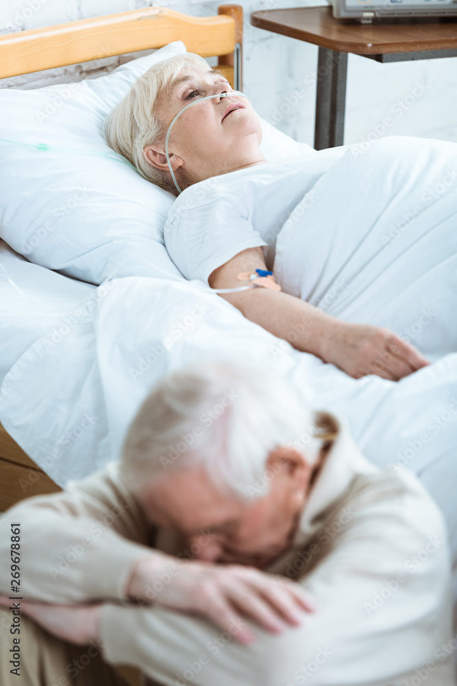 sad senior man and senior woman in coma in hospital sad senior man and senior woman in coma in hospital