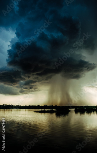 Hurricane over louisiana. Storm clouds and rain over the Mississippi photo