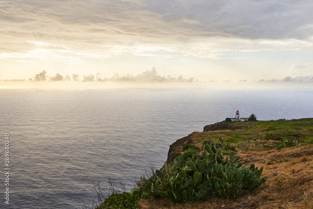Red lighthouse at sunset in Ponta do Pargo, Madeira with beautiful colours               