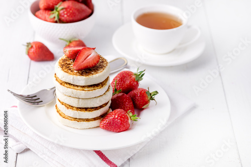 Tasty Homemade Cottage Cheese Pancakes with Strawberries on White Plate Tasty Healthy Diey Breakfast Breakfast Concept Horizontal Copy Space