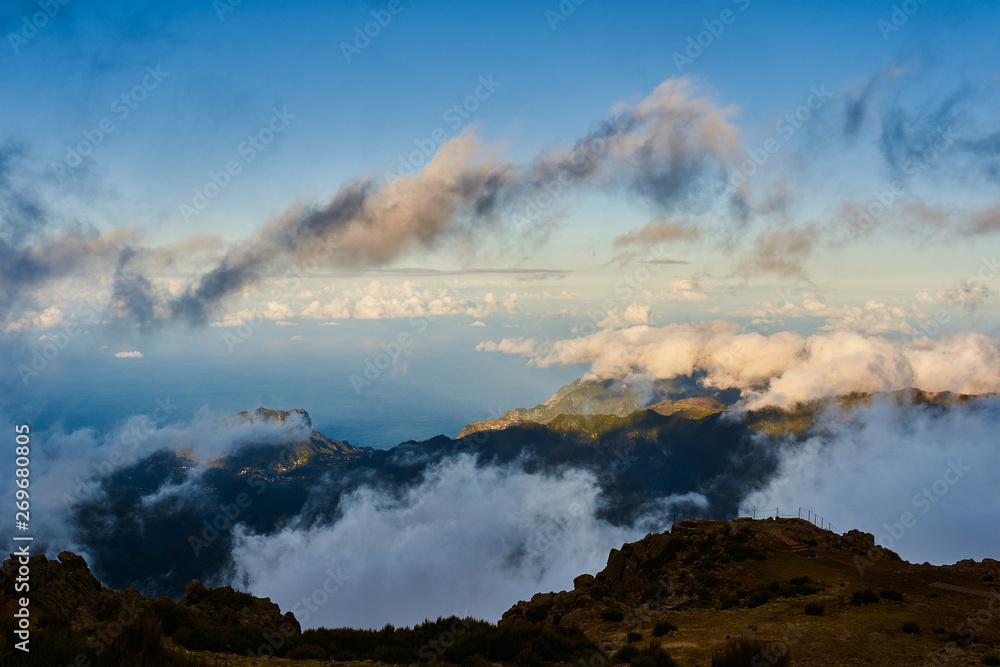 Mountain view from pico de arieiro with mountains, ocean, clouds and blue sky