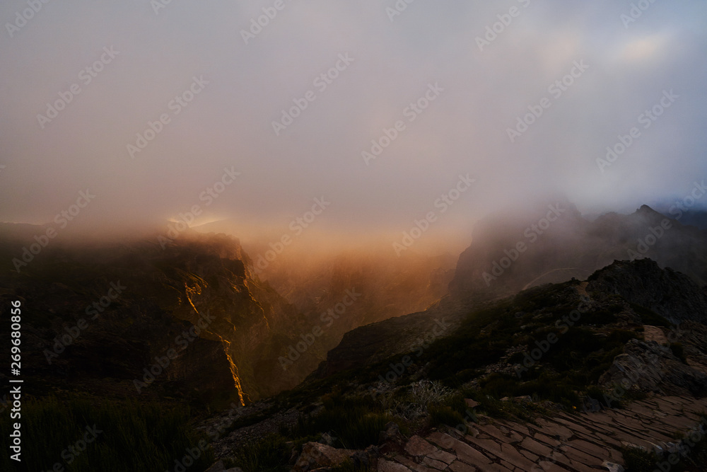 Fototapeta premium Sunset on mountain with gold sky, pico de arieiro, Madeira