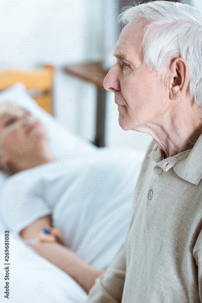 sad senior man and senior woman in coma in hospital sad senior man and senior woman in coma in hospital