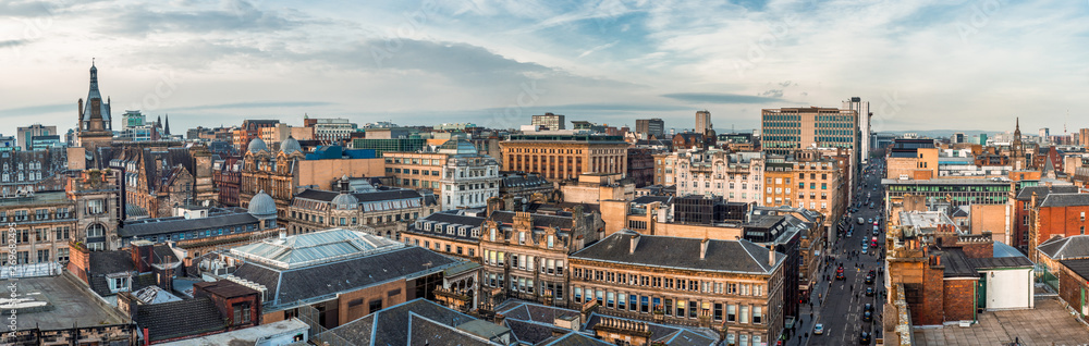 A wide panoramic looking out over old and new buildings and streets in Glasgow city centre. Scotland, United Kingdom