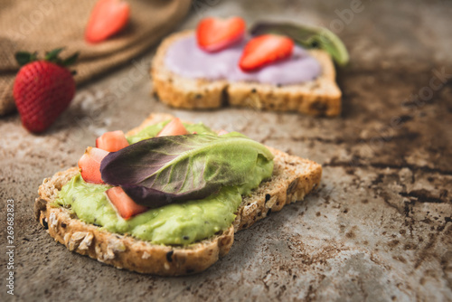 bread wholegrain mashed avocado and blueberry with strawberry 