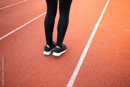 female woman exercise running at sport stadium