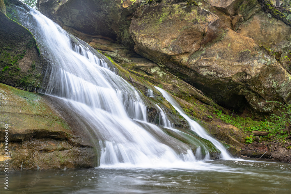 Fototapeta premium Mountain river waterfall landscape. Stone cascade stream among rocks