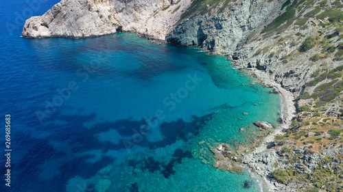 Aerial drone photo of deep turquoise crystal clear sea and rocky sea shore, Folegandros island, Cyclades, Greece © aerial-drone