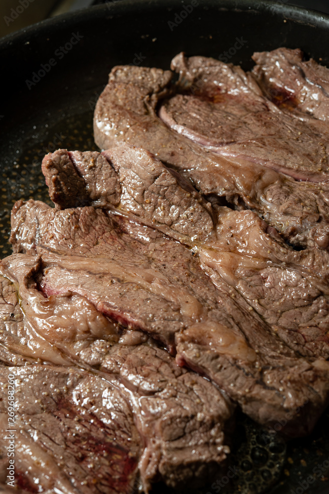 Cooking scene of beef steak