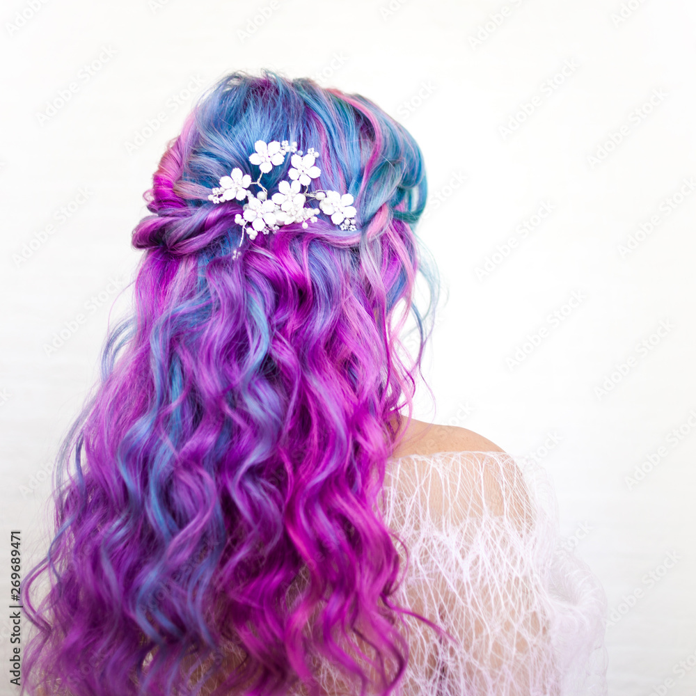 Naklejka premium Beautiful and healthy hair with bright coloring. Long curly hair purple and pink tones