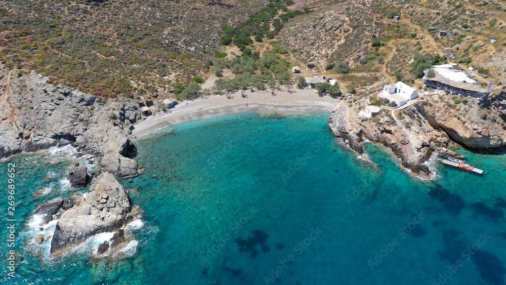 Obraz premium Aerial drone photo of secluded deep turquoise beach of Agios Nikolaos with crystal clear sea and sandy sea shore, Folegandros island, Cyclades, Greece