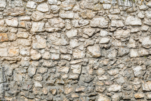 Limestone rock brick wall and mortar background