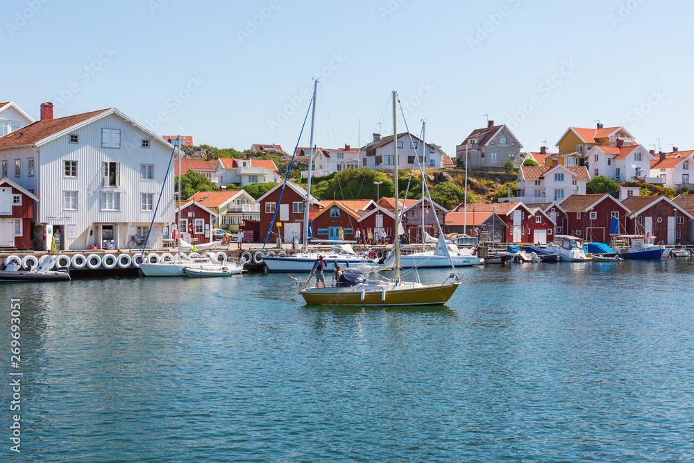 Harbor with boats and houses in an old fishing village