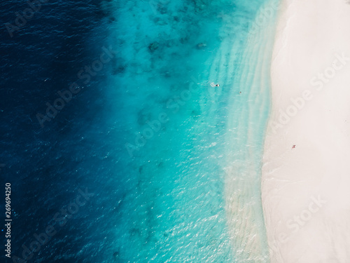 Beautiful tropical beach with turquoise crystal ocean, aerial view. Gili islands