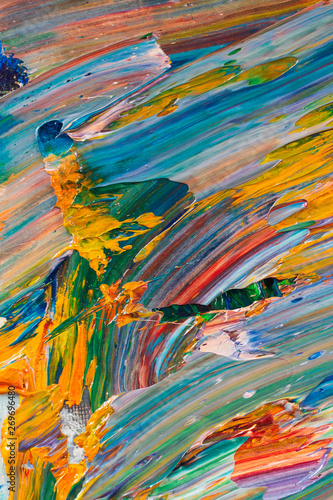 Bright  juicy  multi-colored abstraction of their mixing of oil paints on a palette close-up.